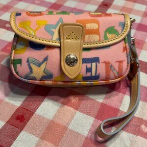 Vintage Dooney & Bourke Pink Graffiti Leather Wristlet with charm. NWOT